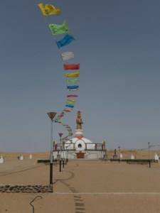 A view of a monastery museum and prayer flags.