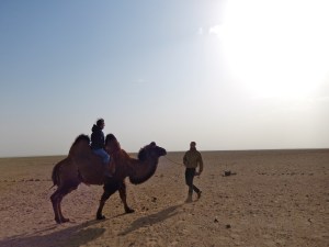 This is me riding a camel with Kit leading me. To put the size of the camel into perspective, Kit is over 6 feet tall.