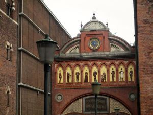 One of the gates within the Carlsberg Factory depicting members of the Jacobsen family