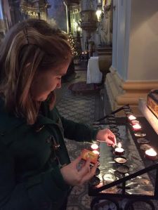 Lighting candles at various Churches in Budapest to give thanks for my family and friends.