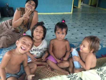 My curious siblings surround my bed whenever I arrive at the house. This time, I gave them all pigtails.